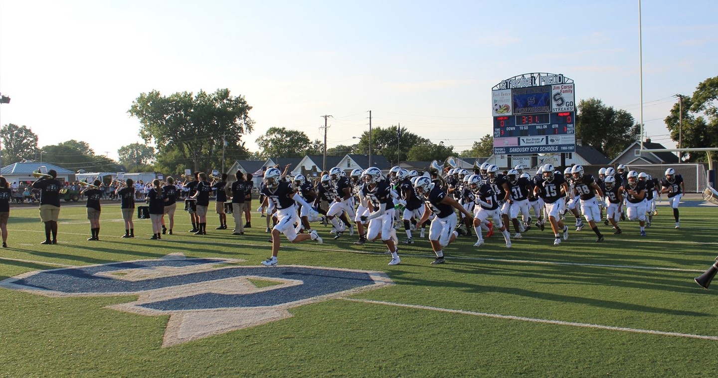 Football players and band members